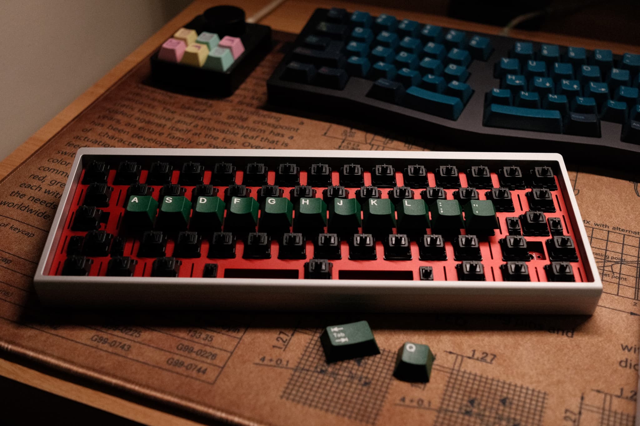 Mechanical keyboard with keycaps being put on