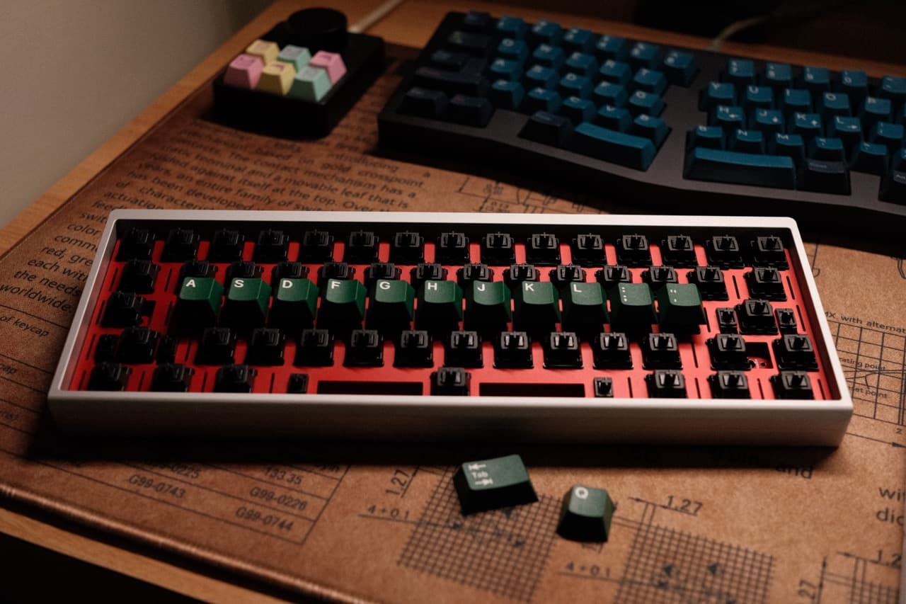Mechanical keyboard with keycaps being put on