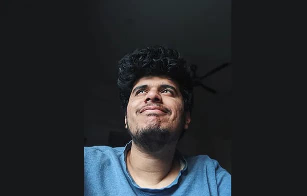 Photo of Ratik looking away from the camera and into the sky